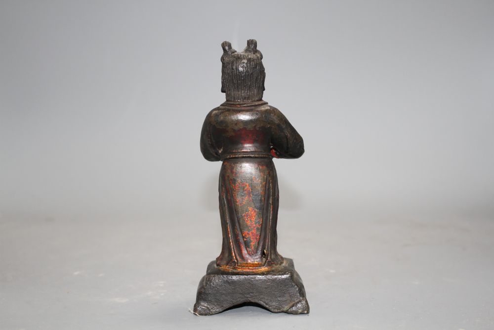 A 17th century Chinese bronze figure, with remnants of polychrome lacquer, h.16cm